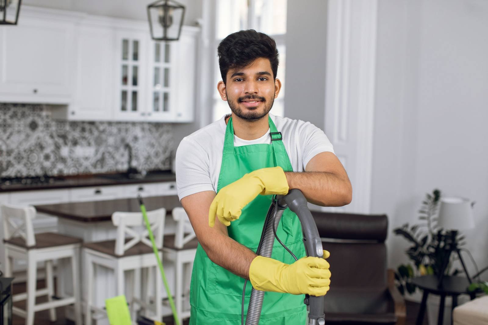Cleaner in gloves ready for a post construction clean